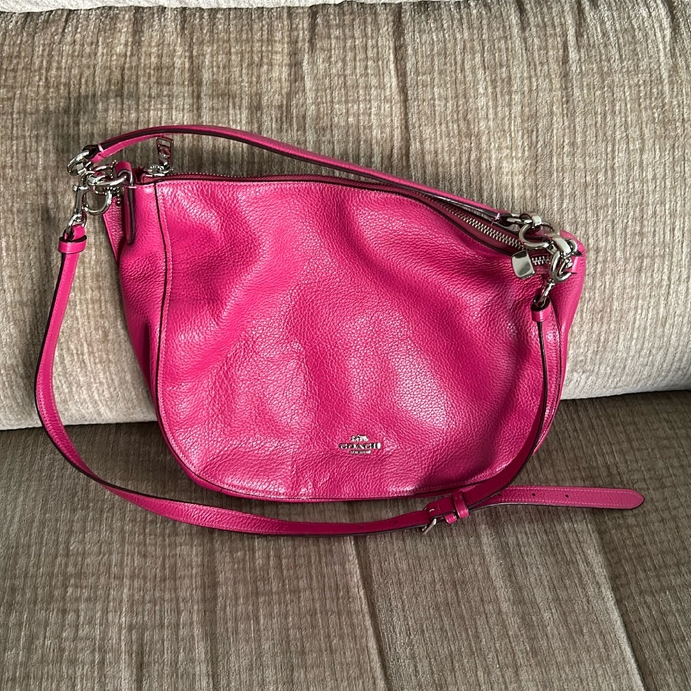 Coach, fuchsia pebble, leather bag with zipper closure, plus new guitar strap.